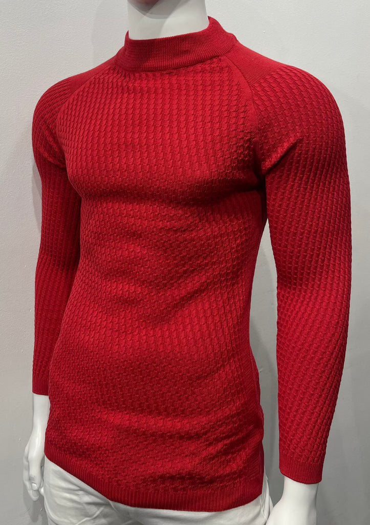 Brick long-sleeve, turtleneck sweater with raglan sleeve design as seen from the front. There is a waffle weave pattern woven into the knit fabric.