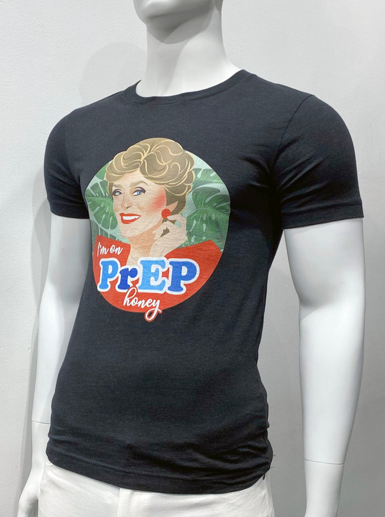 Black T-shirt as seen from the front, with a colorful graphic rendering of the face of Blanche Devereaux from the TV Show, Golden Girls, on the front. Below her are the words: "I'm on Prep, Honey."