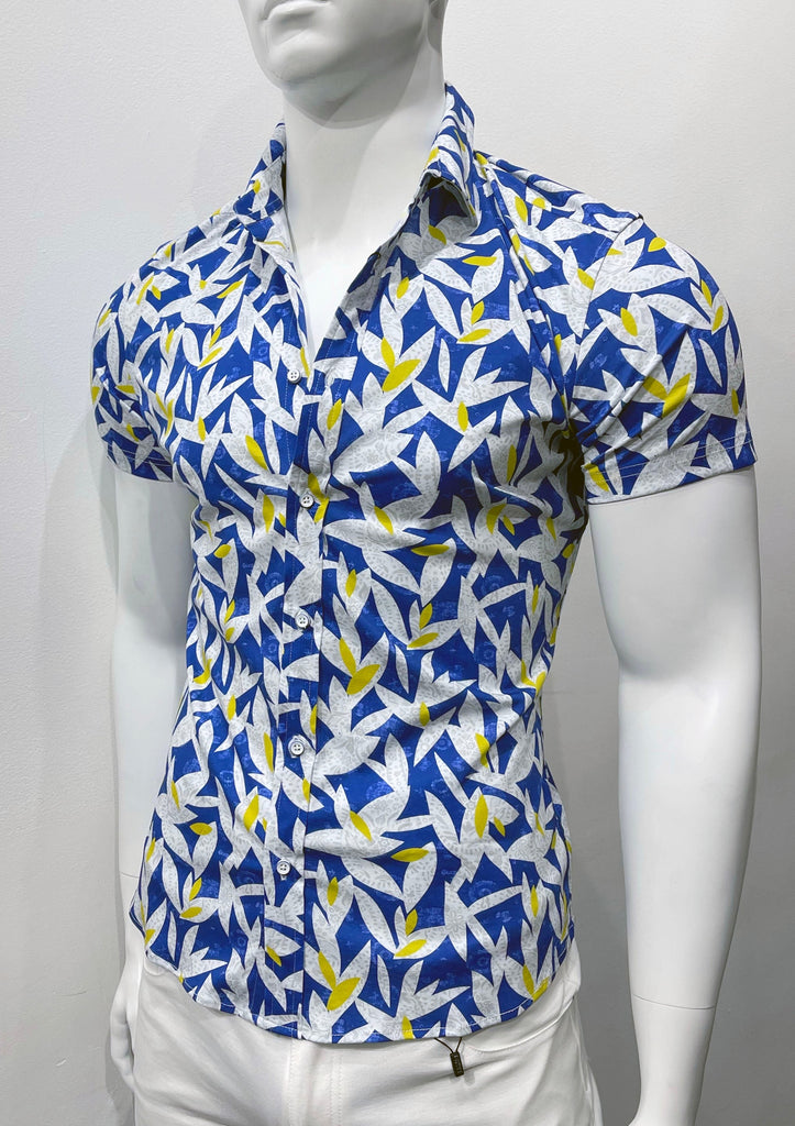   White short-sleeved button down shirt with blue, white and yellow floral and leaves pattern, as seen from the front.
