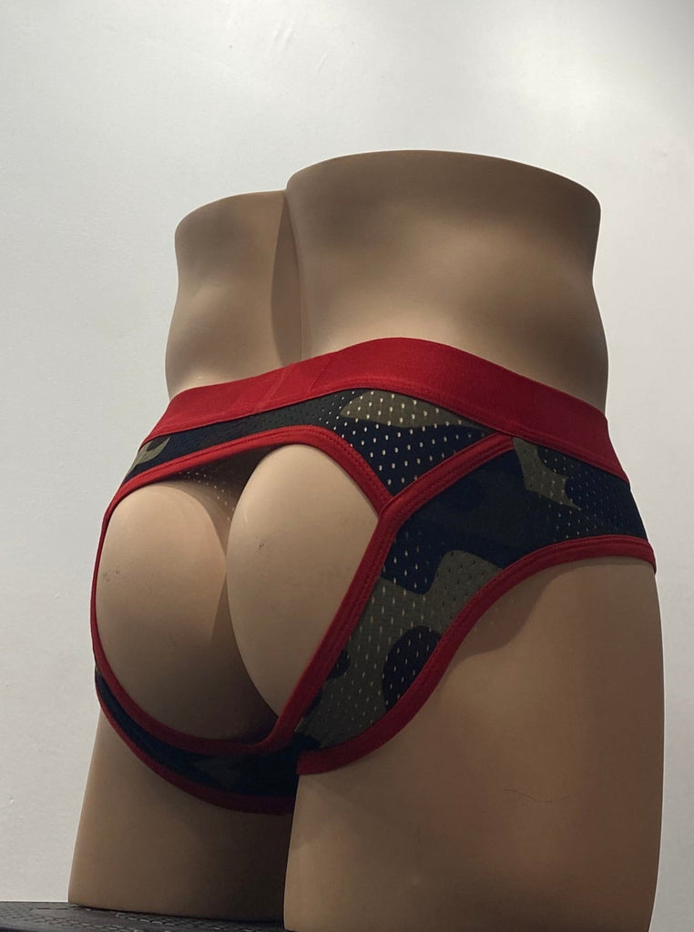 Mesh green camouflage brief with red piping design accents, as seen from the back. It has a thick red waistband. The back of the brief is bottomless.