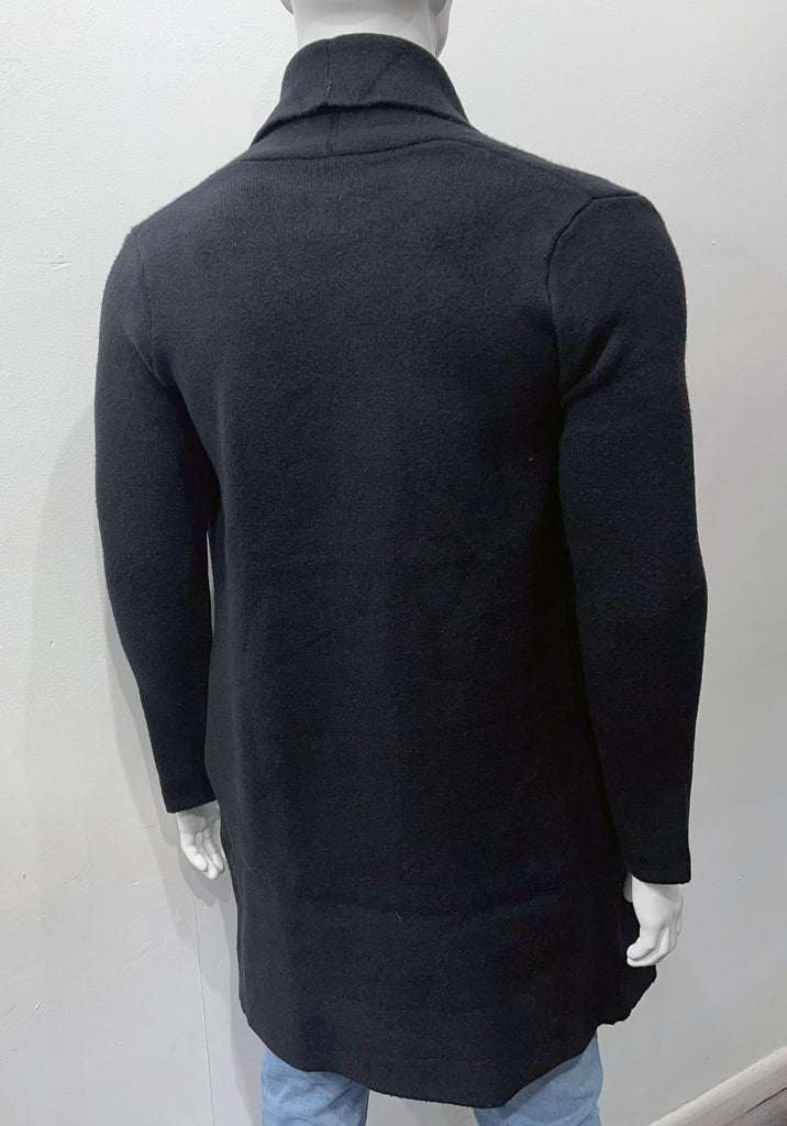 Black buttonless collared wrap overcoat as seen from the back.