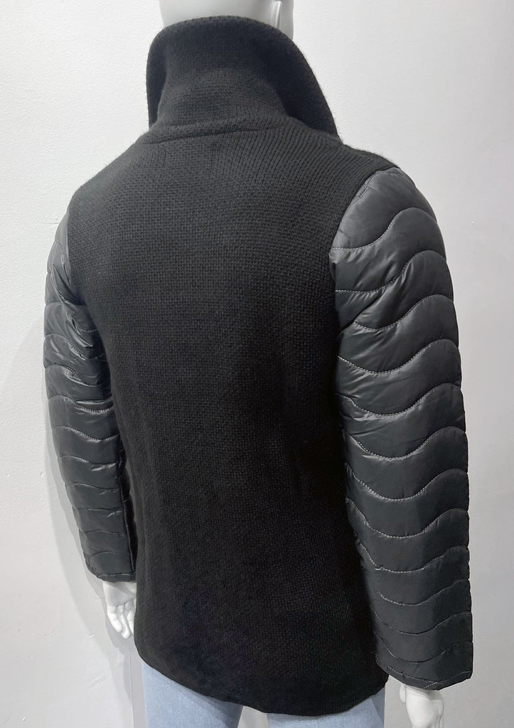 Black, double-breasted overcoat as seen from the back. Sleeves are lined with puffer coat material.