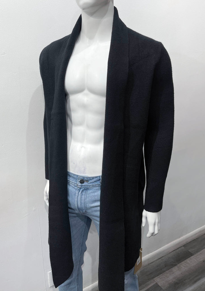 Black buttonless collared wrap overcoat as seen from the front.