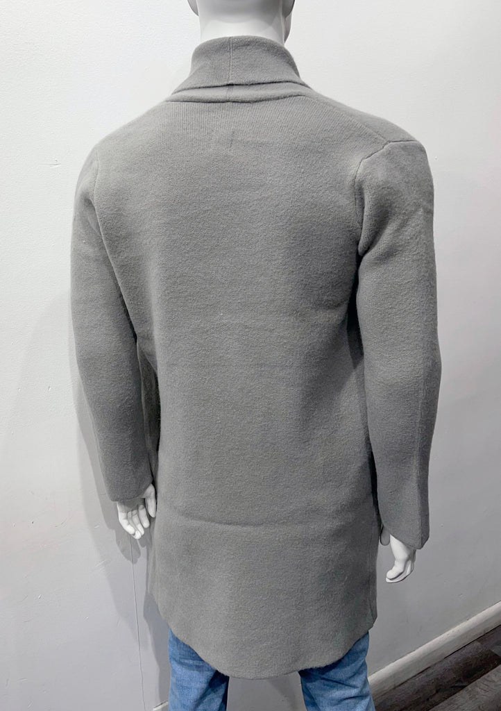 Grey buttonless collared wrap overcoat as seen from the back.