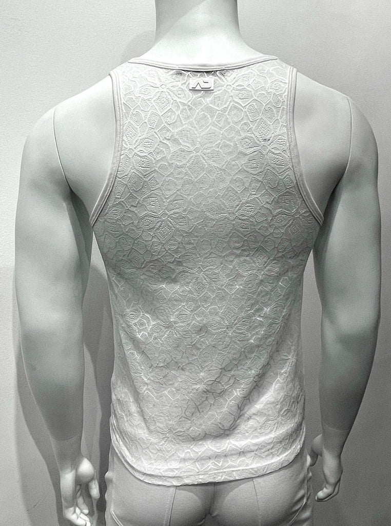 White tank top made from mesh material as seen from the back, with a floral pattern woven into the mesh.