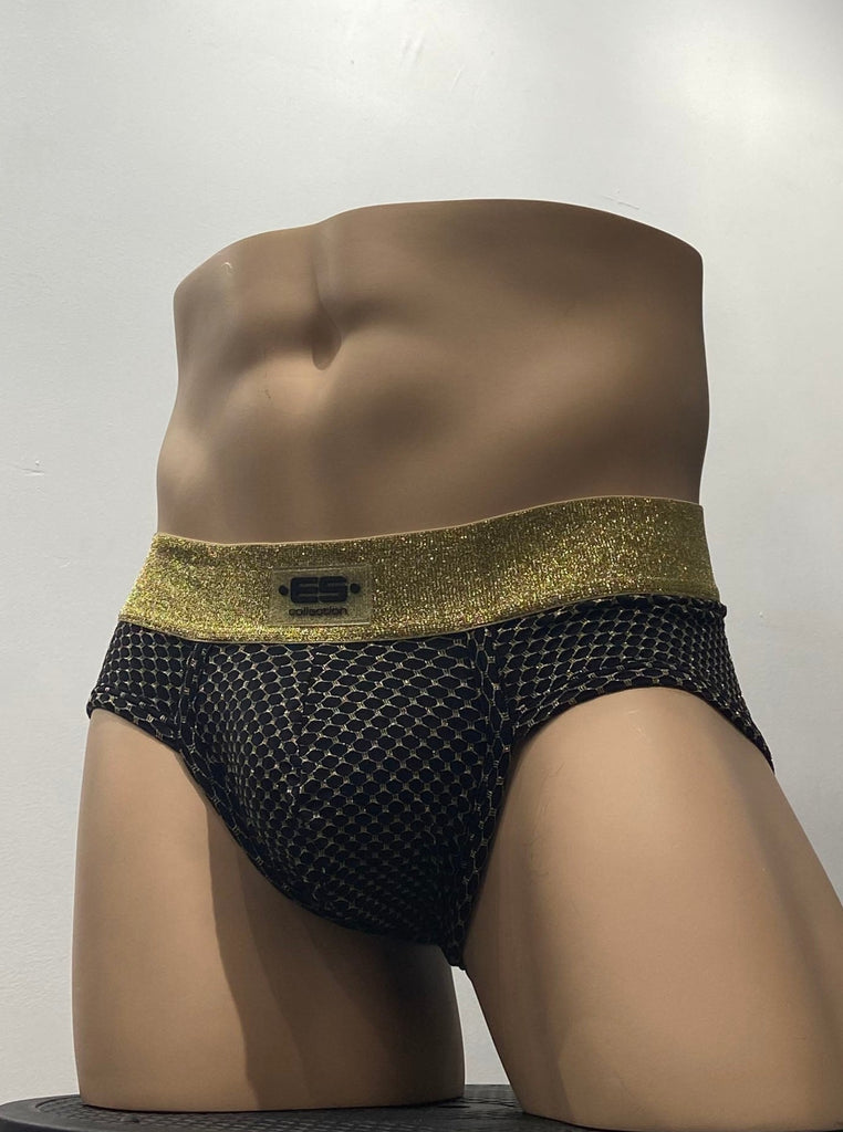 Black stretch brief with shiny, gold embroidered chain mail pattern, as seen from the front. It has a thick, shiny gold waistband with a brand emblem on it, front and center.