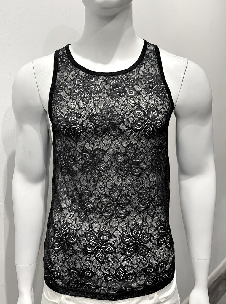 Black tank top made from mesh material as seen from the front, with a floral pattern woven into the mesh.