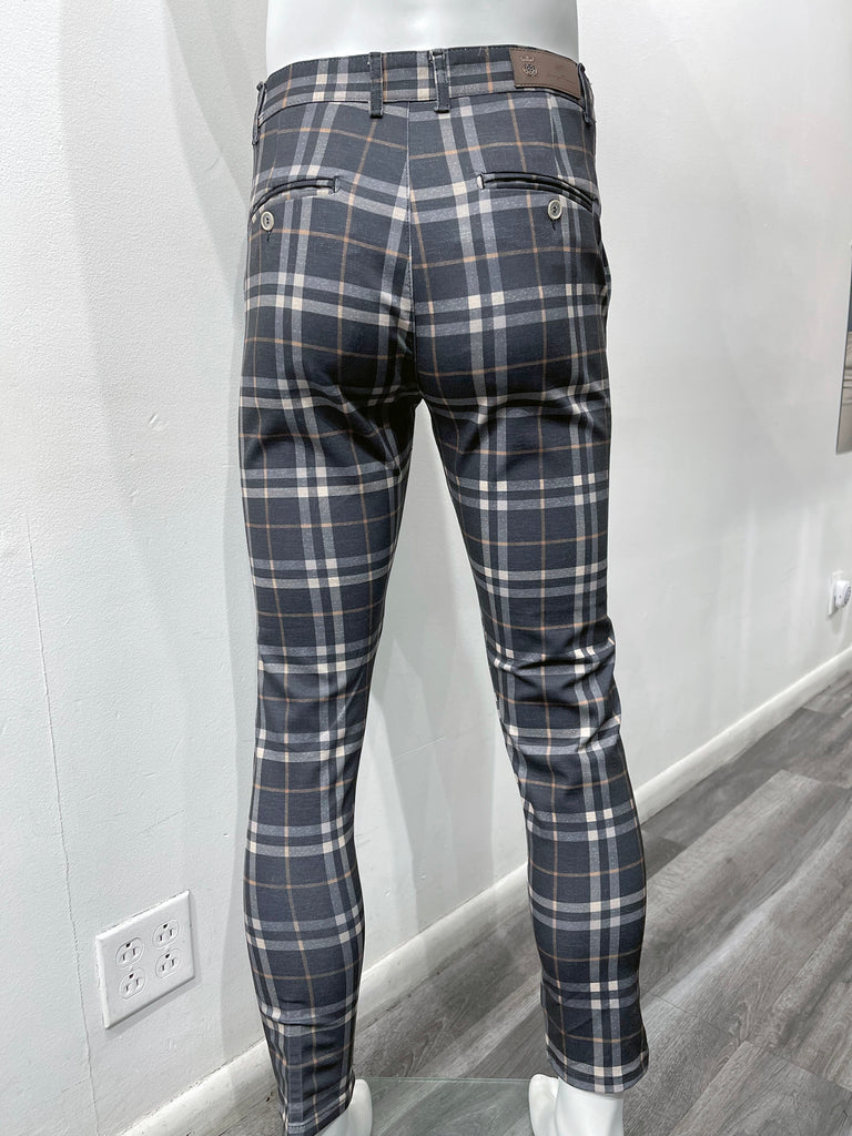 Navy flat front pants with a pink and white plaid pattern, as seen from the back.