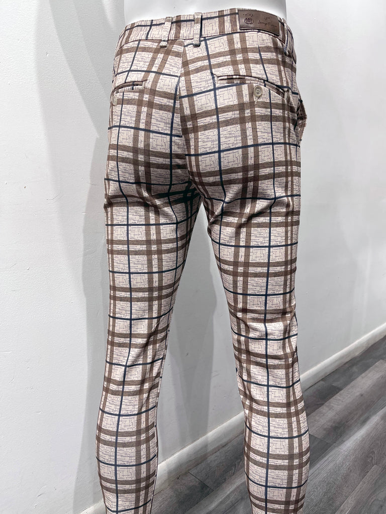 Light brown flat front pants with dark brown and dark blue plaid pattern, as seen from the back.