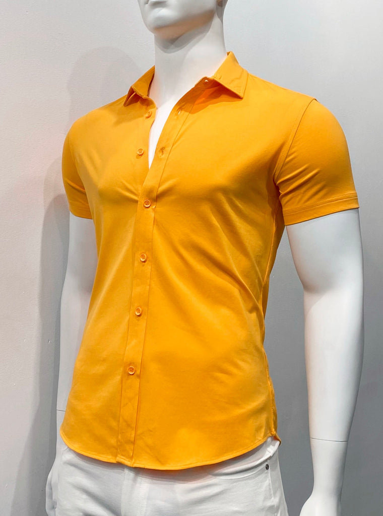 Papaya colored short sleeve button-down shirt as seen from the front. The buttons are papaya color.
