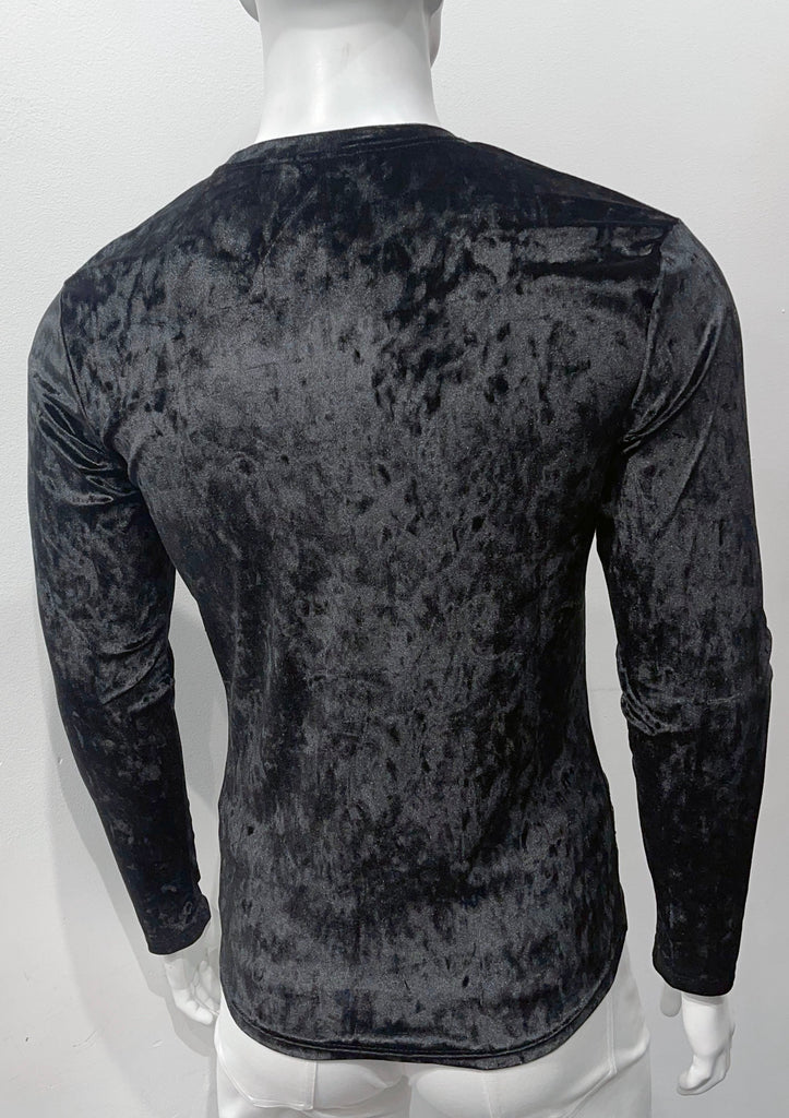 black velvet, long-sleeve shirt, as seen from the back.