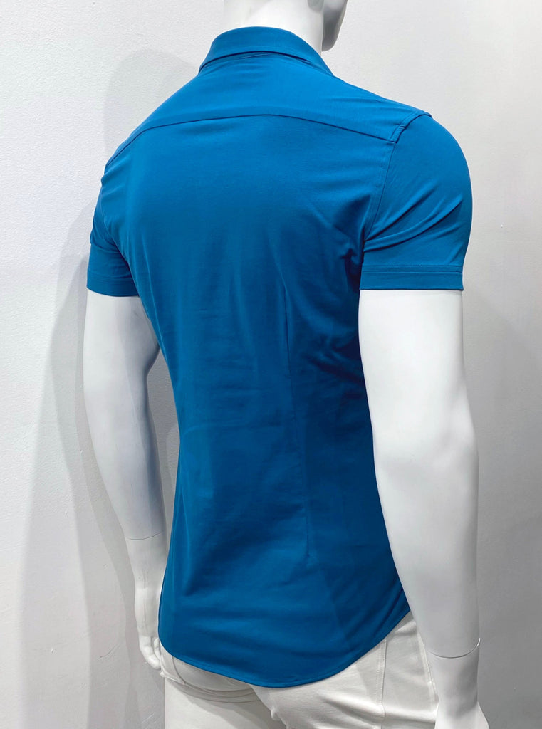 Short-Sleeved, button-down deep teal blue shirt, as seen from the back.