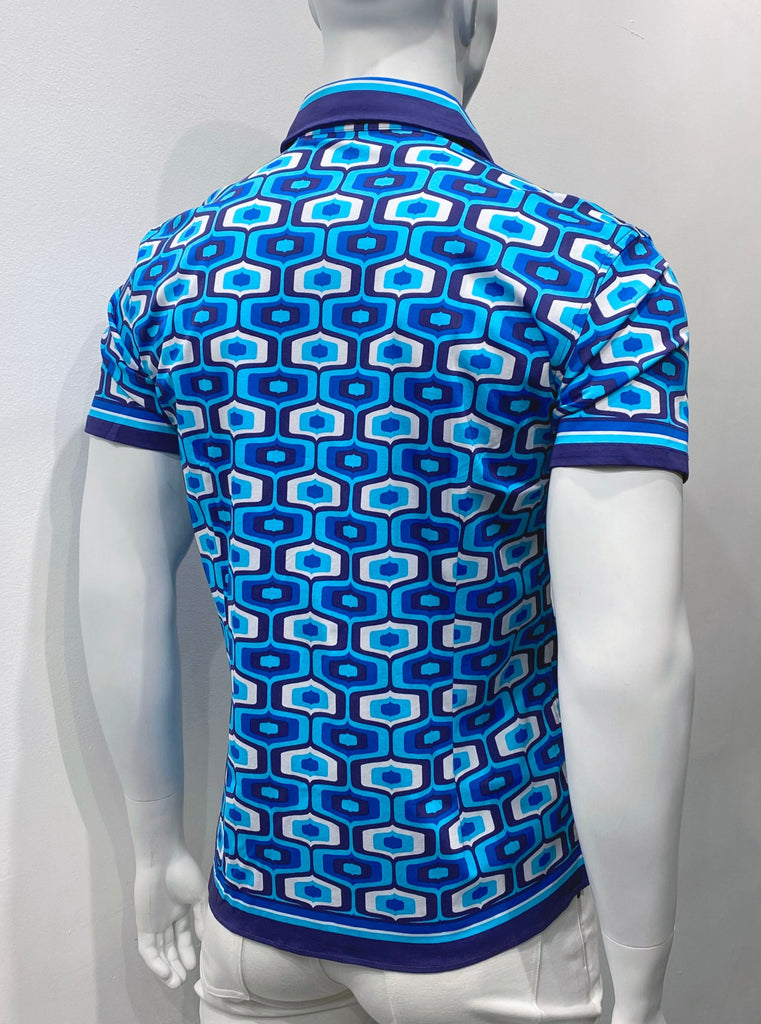 Short-sleeved button-down shirt as seen from the back. It has a violet, dark blue, royal blue, light blue and white mod graphic pattern of tops. The sleeve cuffs, collar and shirt hem are edged with a thin stripe made up of smaller stripes of white, light blue, royal blue, navy blue, and violet. 