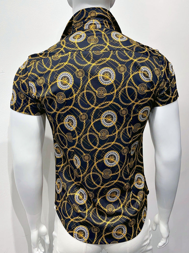 Short-sleeved, button-down collared shirt, as seen from the back. It has a graphic, design comprised of circles made of gold link chains and also white and gold circular emblems with stars in the center, all on a dark blue and black cheetah pattern background.