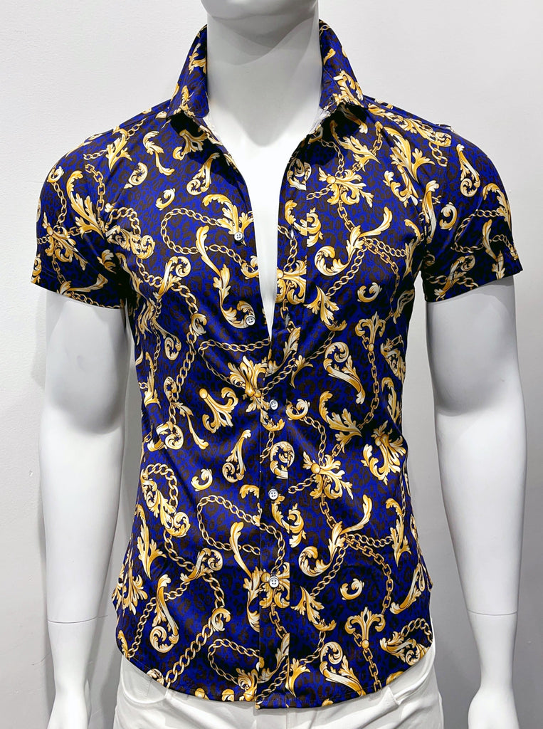 Short-sleeved, button-down collared shirt, as seen from the front. It has graphic, gold deco designs on a dark blue and black cheetah pattern background. The buttons are white.