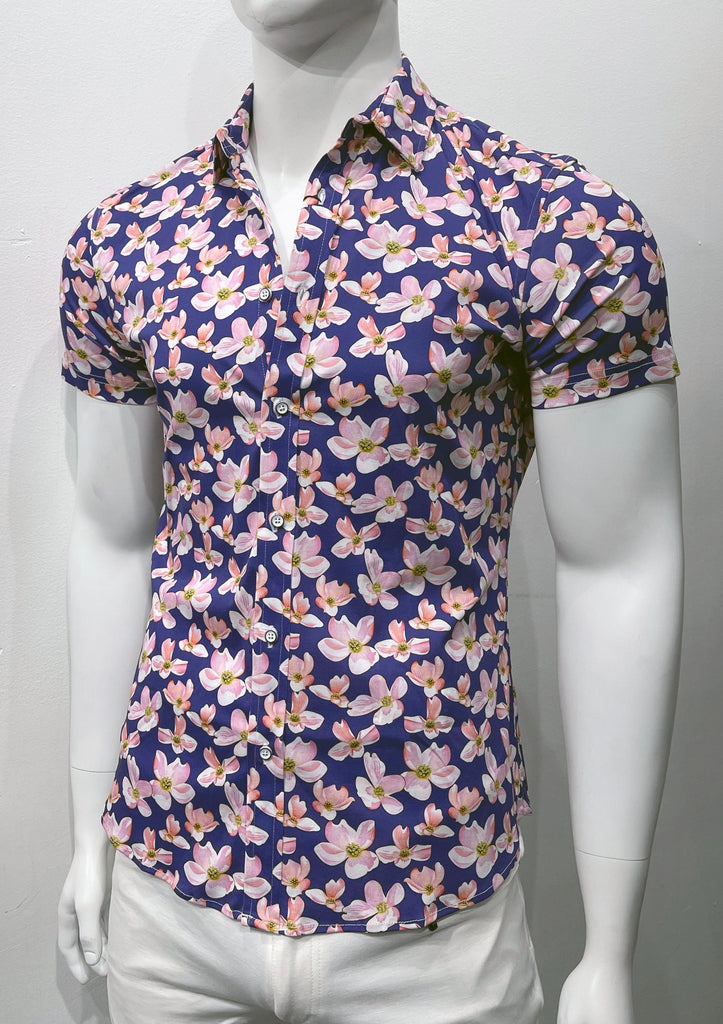 Navy short sleeved button down shirt with pink, white and citrus floral pattern, as seen from the front.