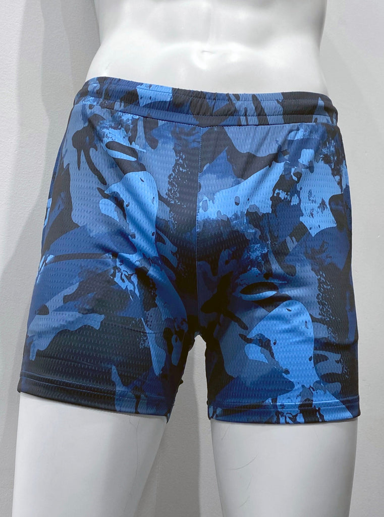 Slate blue, royal blue, light blue and black camouflage pattern athletic shorts with mesh fabric as seen from the front, with elastic waistband and two front pockets.