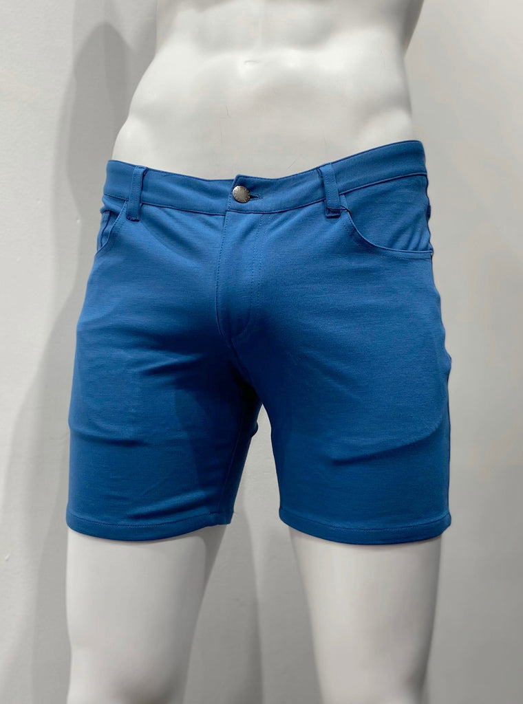 Lagoon blue, zip-front, 5-pocket stretch knit shorts, as seen from the front.