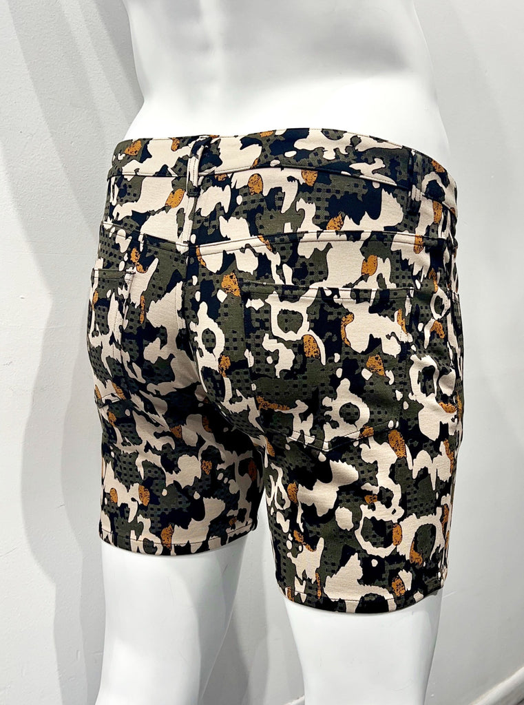 5-pocket stretch knit shorts with an army green, beige, black and orange camouflage pattern, as seen from the back.