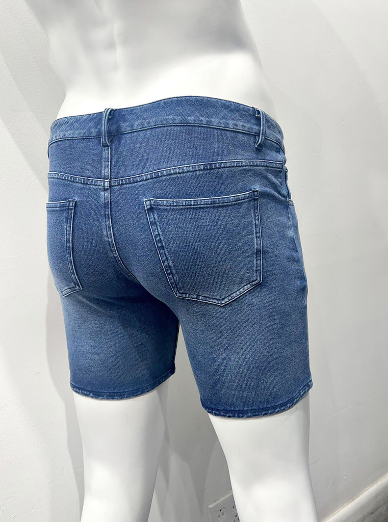 Vintage blue 5-pocket stretch denim shorts, as seen from the back.