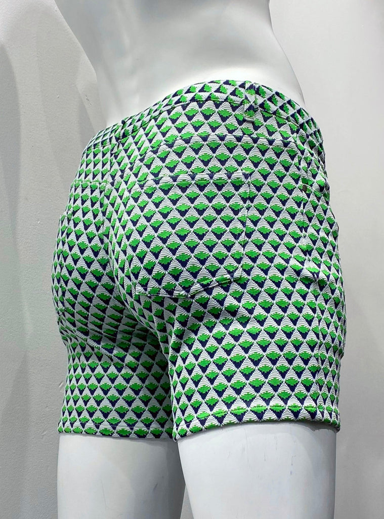 Zip-front, 5-pocket black stretch knit shorts as seen from the back, with a textured diamond grid pattern made up of little, equally-sized diamond shapes that are white on the top half, navy on the bottom half, and half, and are lime green across the horizontal centerline.