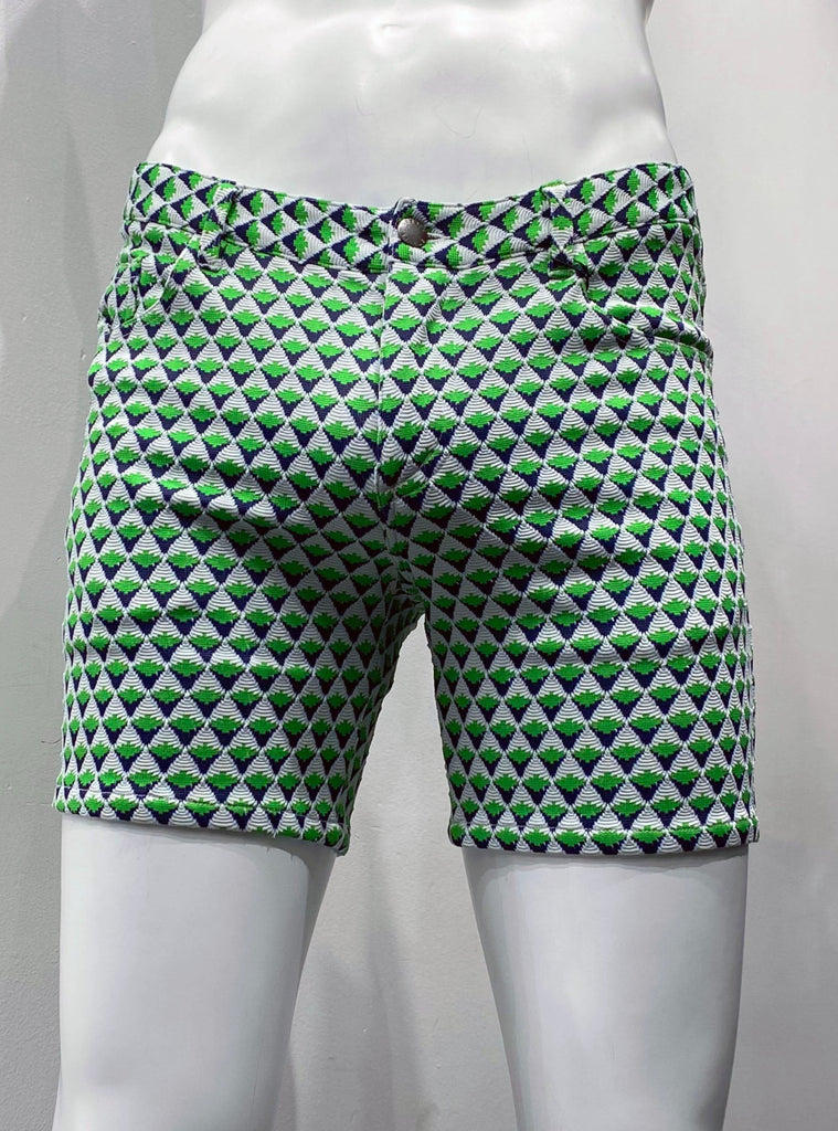 Zip-front, 5-pocket black stretch knit shorts as seen from the front, with a textured diamond grid pattern made up of little, equally-sized diamond shapes that are white on the top half, navy on the bottom half, and half, and are lime green across the horizontal centerline.