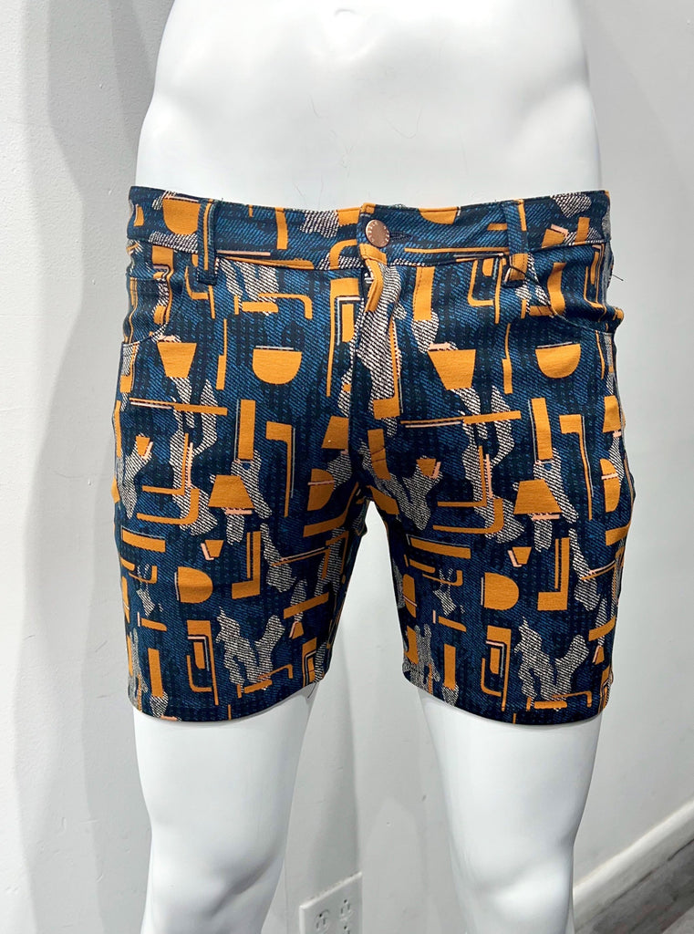 Navy blue 5-pocket stretch knit shorts with an orange, grey and teal pop art pattern, as seen from the front.