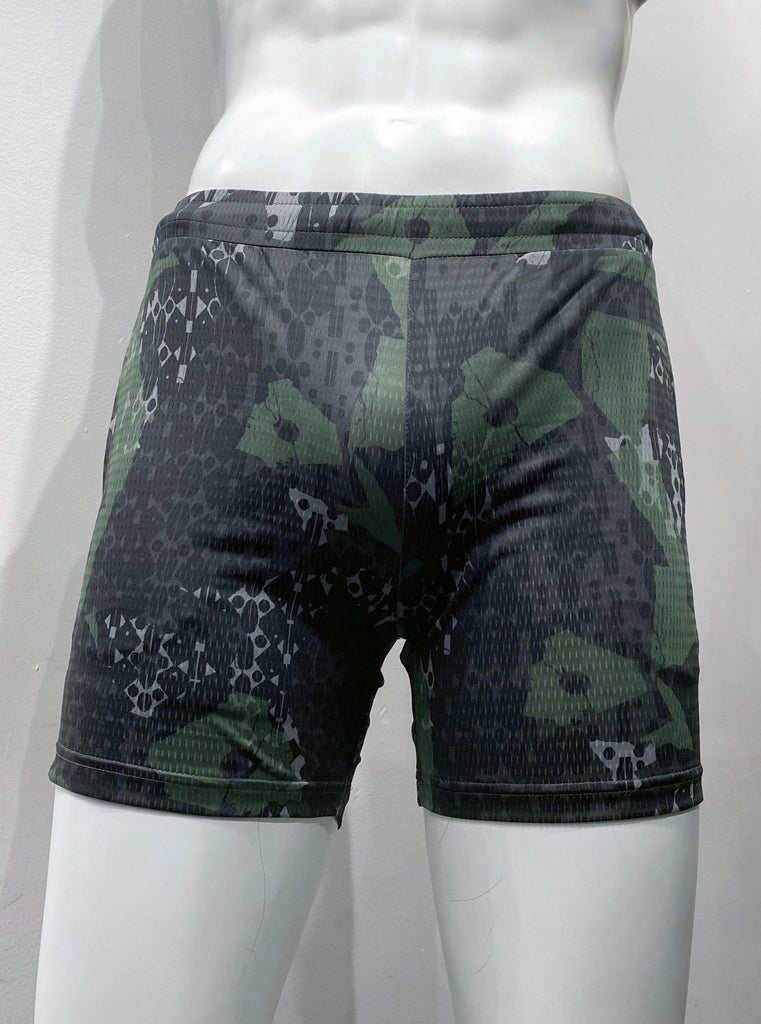 Khaki green, grey, and black and camouflage pattern athletic shorts with mesh fabric as seen from the front, with elastic waistband and two front pockets.