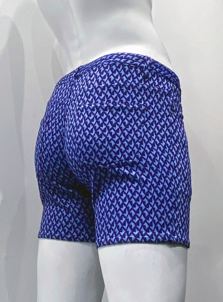 Zip-front, 5-pocket black stretch knit shorts as seen from the back, with a textured navy blue, violet and sky blue chevron grid pattern.