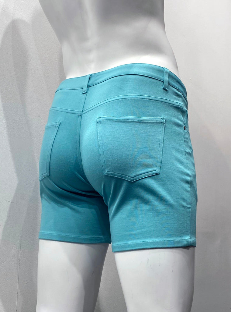 Nile teal, zip-front, 5-pocket stretch knit shorts, as seen from the back.