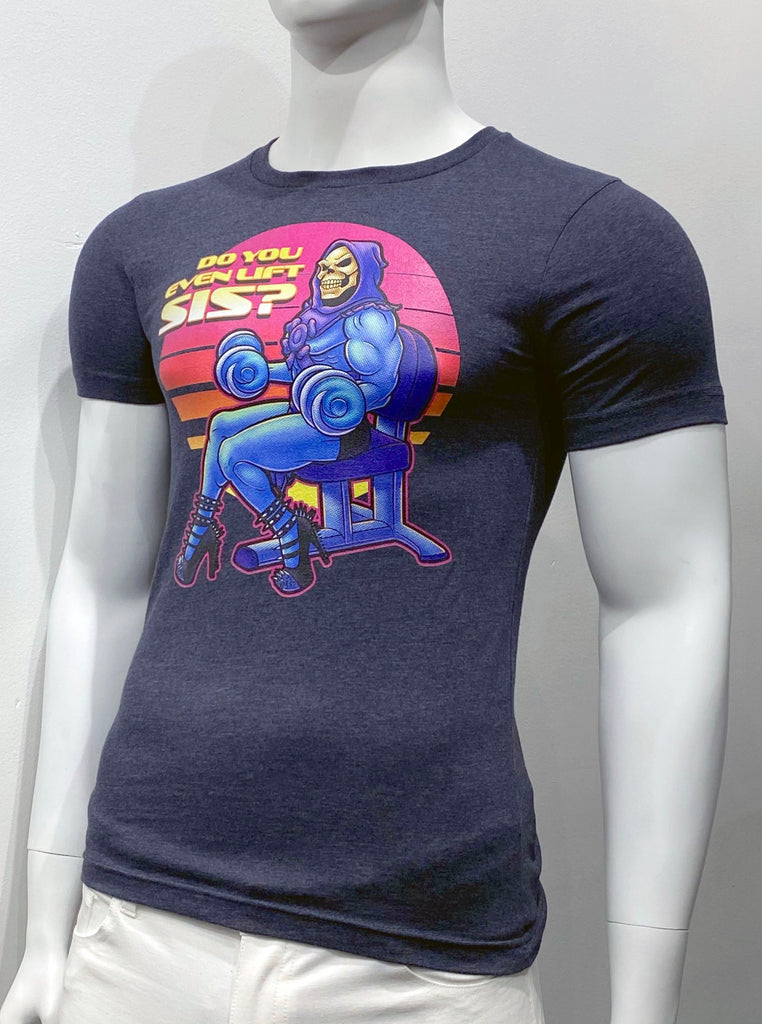 Dark blue T-shirt as seen from the front, with a graphic illustration of Skeletor from the Msters of The Universe cartoon show. He is sitting in a chair doing dumbell curls with high heels on. Next to his head, it reads: "Do you even lift, sis?"