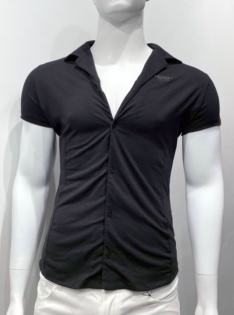 Black short-sleeved button-down collared shirt with black buttons as seen from the front. There is a small brown leather patch with a round silver snap detail on the front of the left sleeve, and a brand emblem woven into the left breast.