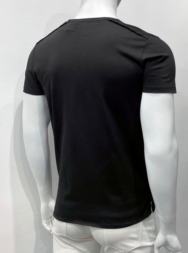 Black T-shirt with an extended torso length, as seen from the back. The hem is split on the sides and about an inch lower in back than in the front.