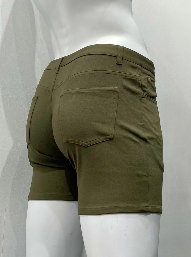 Olive green, zip-front, 5-pocket stretch knit shorts, as seen from the back.