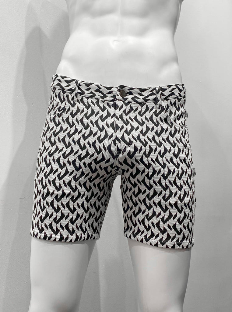 Zip-front, 5-pocket stretch knit shorts with a black and white herringbone pattern, as seen from the front.