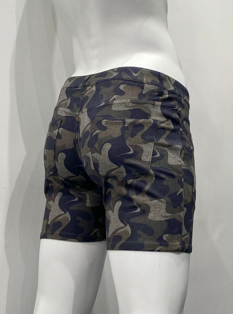 Green camouflage, zip-front, 5-pocket stretch knit shorts, as seen from the back. The green camouflage pattern includes black, army green, khaki green and khaki tan colors.