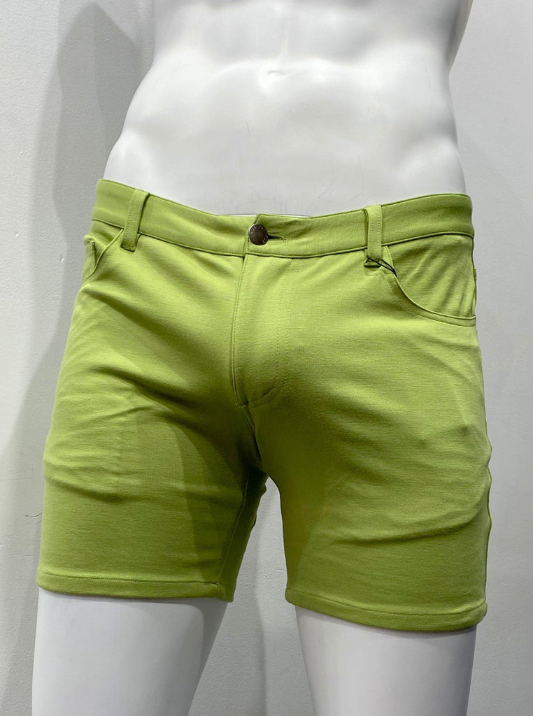 Kiwi green, zip-front, 5-pocket stretch knit shorts, as seen from the front.