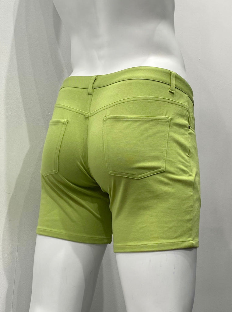 Kiwi green, zip-front, 5-pocket stretch knit shorts, as seen from the back.