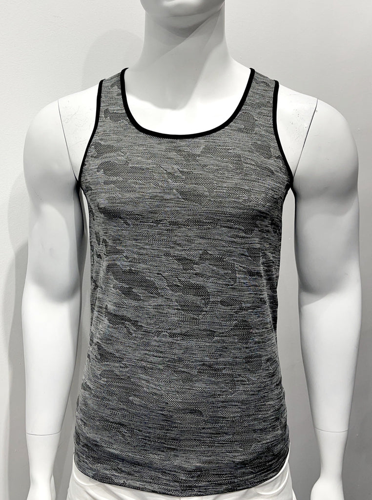 Tank top made from perforated mesh material as seen from the front, with a black and grey camouflage print. There is black piping on both sides of the shoulder straps.
