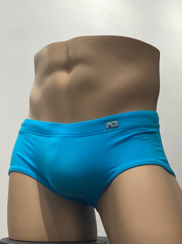 Turquoise sunga swim brief as seen from the back.