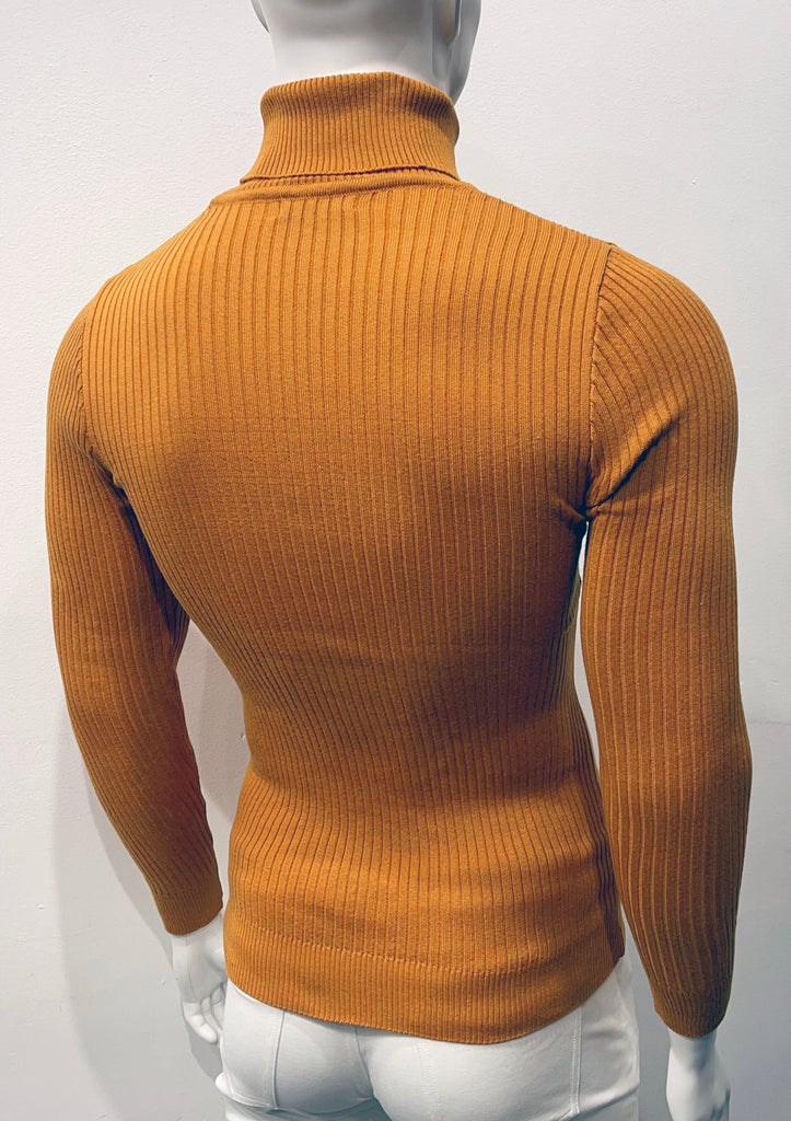 Cinnamon long-sleeve, turtleneck sweater as seen from the back. There is a vertical ribbed pattern woven into the knit fabric.
