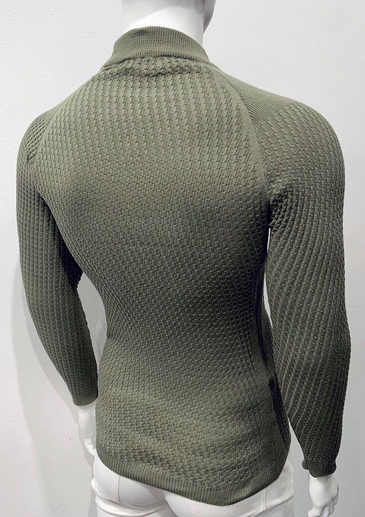 Olive long-sleeve, turtleneck sweater with raglan sleeve design as seen from the back. There is a waffle weave pattern woven into the knit fabric.
