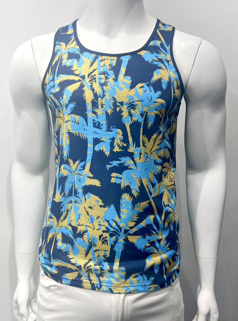 Navy blue tank top as seen from the front, with pattern of gold and light blue palm trees. There is navy blue piping around the arm holes and neck.