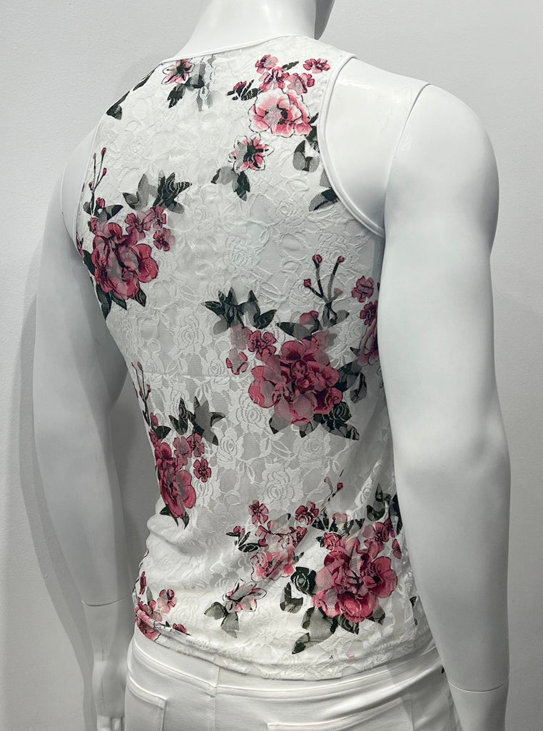 White lace tank top as seen from the back, with a black, red, white and pink floral pattern in the lace.