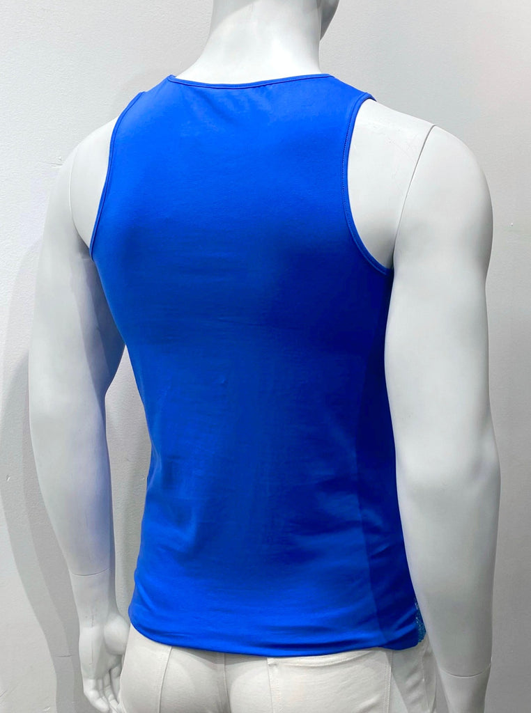 Tank top as seen from the back. There are no blue and pink iridescent sequins on the back. The back is royal fabric with royal blue piping on the outside of the shoulder straps and around the back of the neck.