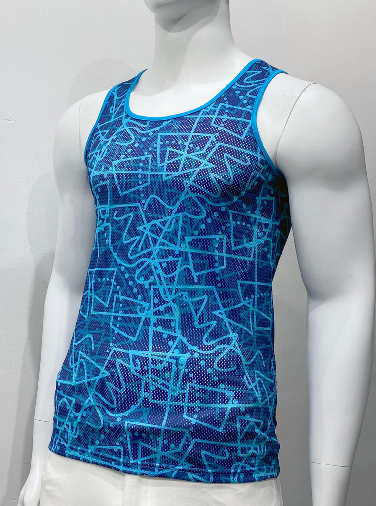 Perforated mesh tank to as seen from the front, with a pattern of dark and light turquoise and teal angular shapes, squiggle lines and dots over a navy background. There is turquoise piping on the shoulder straps and around the neck. There is a thick vertical stripe going up the center of the back panel. This stripe is comprised of five thinner vertical stripes. The two outermost stripes are turquoise, the two second outermost strips are navy, and the single inner stripe is teal.