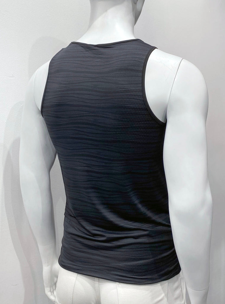 Perforated black mesh tank to as seen from the back, with a pattern of wavy grey horizontal lies covering the back. There is black piping on the shoulder straps and around the neck..