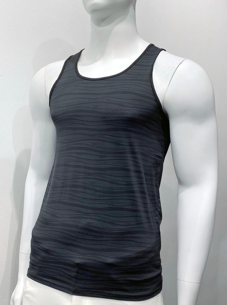 Perforated black mesh tank to as seen from the front, with a pattern of wavy grey horizontal lies covering the front. There is black piping on the shoulder straps and around the neck..